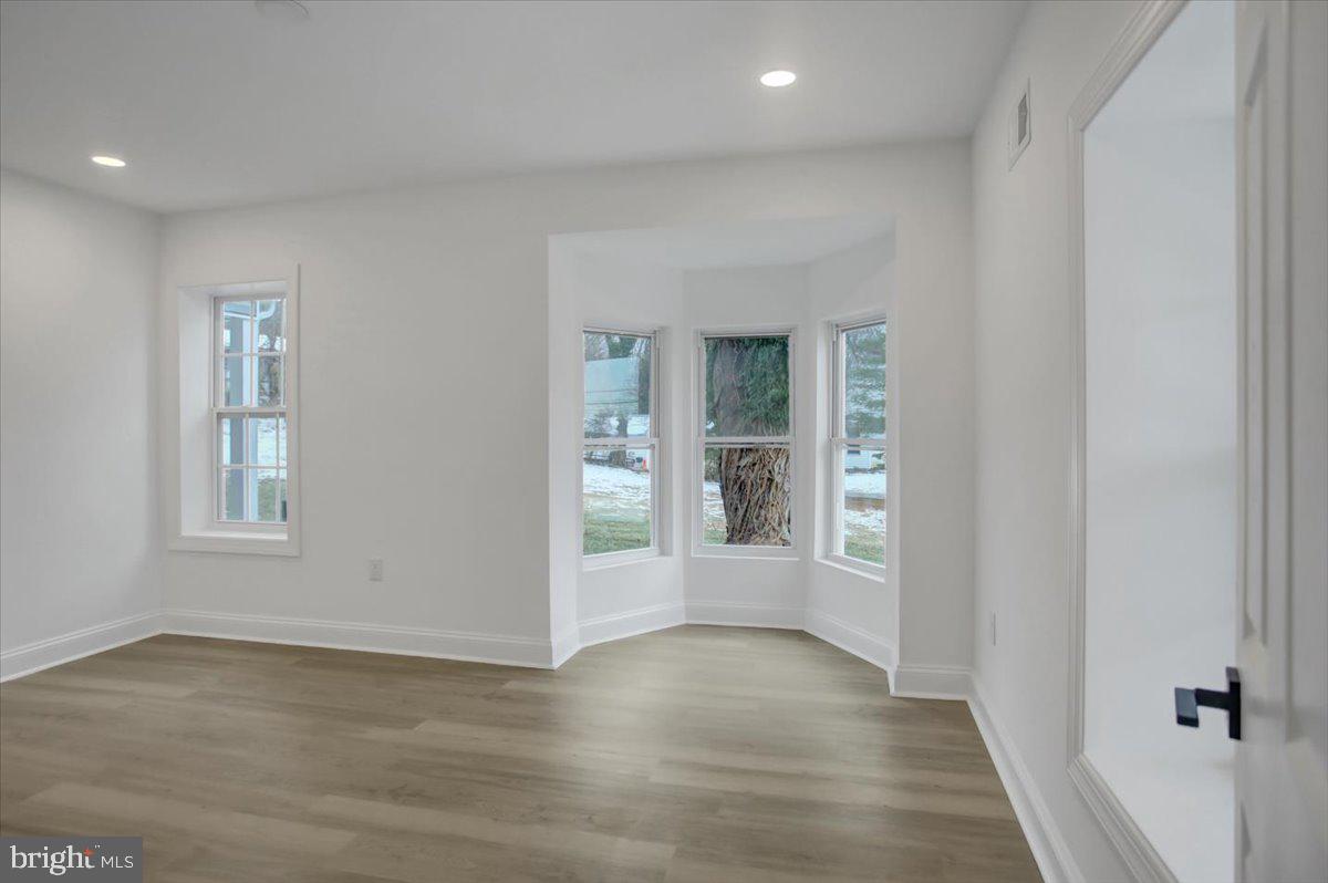 50 St Paul Street Boonsboro, MD 21713 - Photo 19 of 81 an empty room with wooden floor and windows