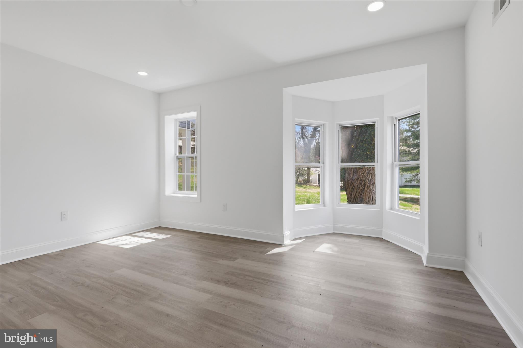50 St Paul Street Boonsboro, MD 21713 - Photo 38 of 81 a view of an empty room with wooden floor and a window