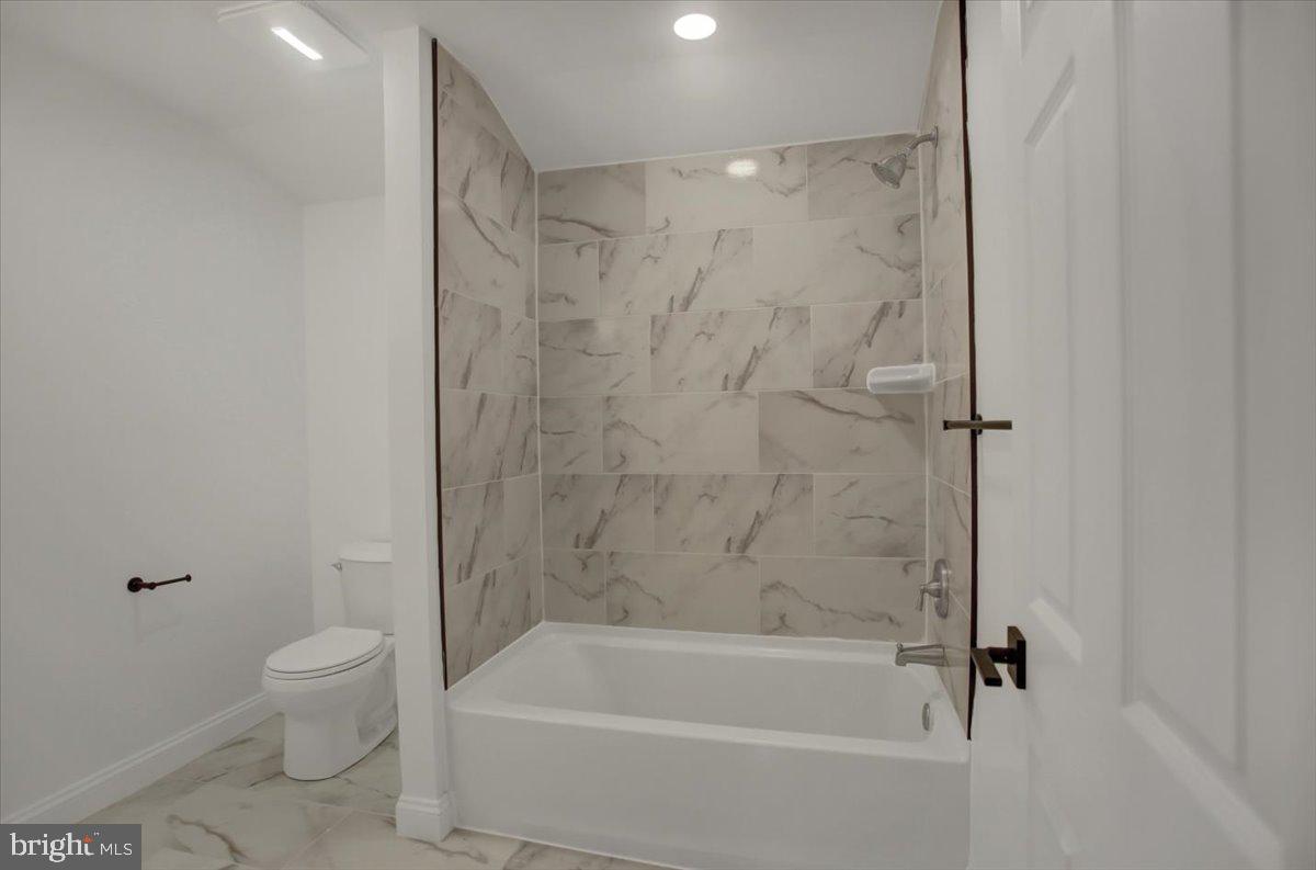 50 St Paul Street Boonsboro, MD 21713 - Photo 43 of 81 a bathroom with a bathtub and a toilet