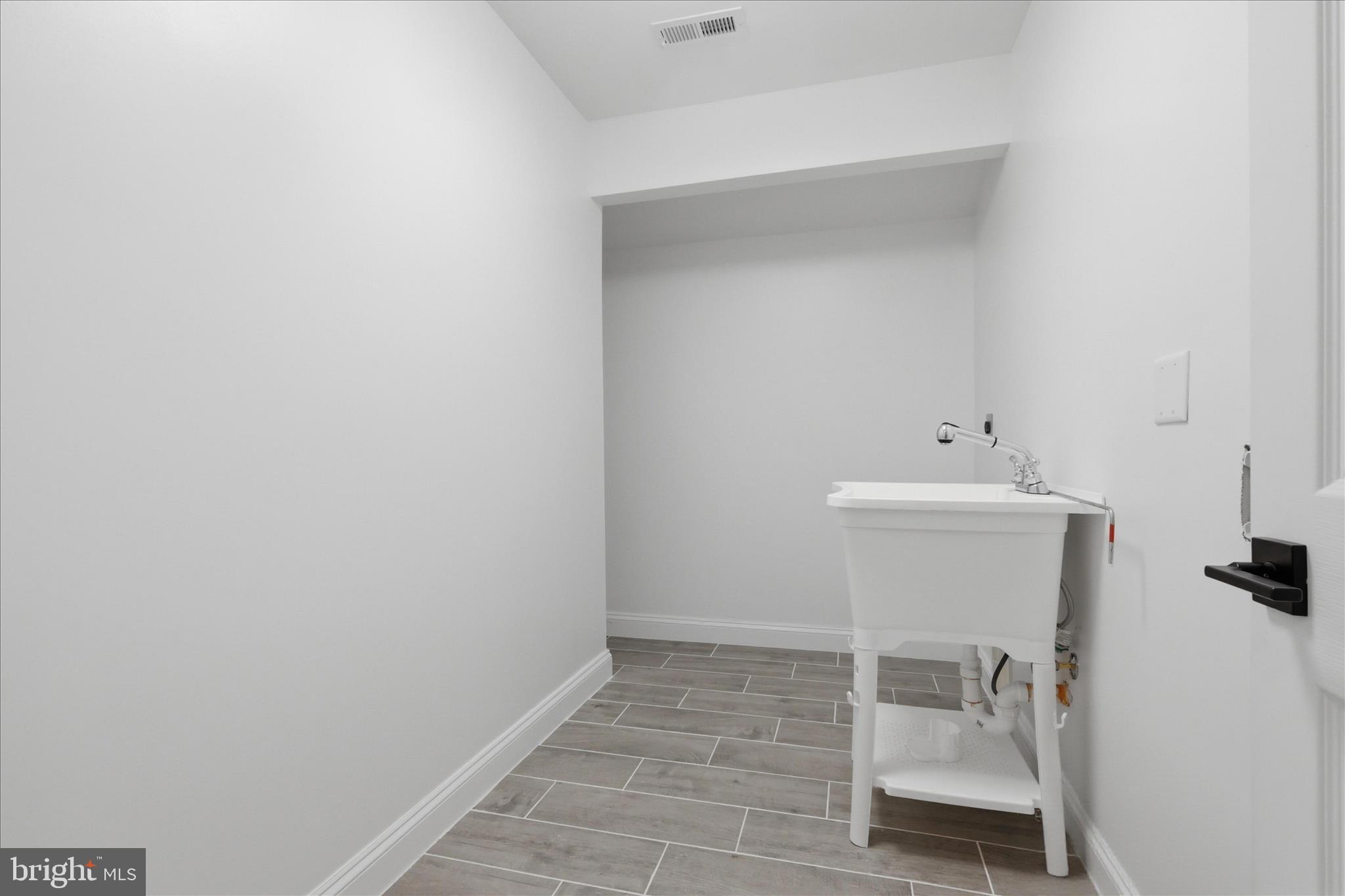 50 St Paul Street Boonsboro, MD 21713 - Photo 56 of 81 a bathroom with a sink and a mirror
