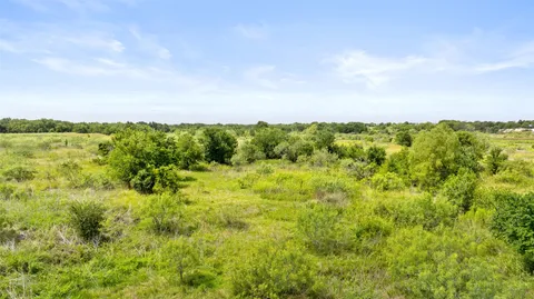 a view of lake with green space