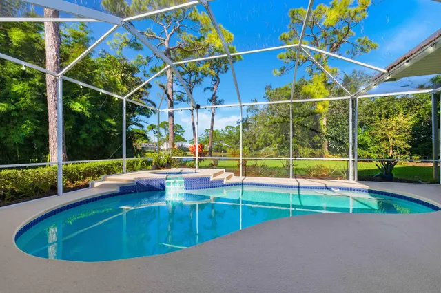 an aerial view of a houses with a lake view