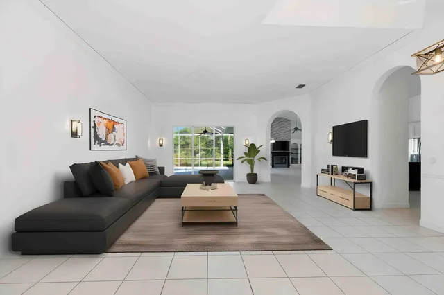 a living room with furniture and a flat screen tv
