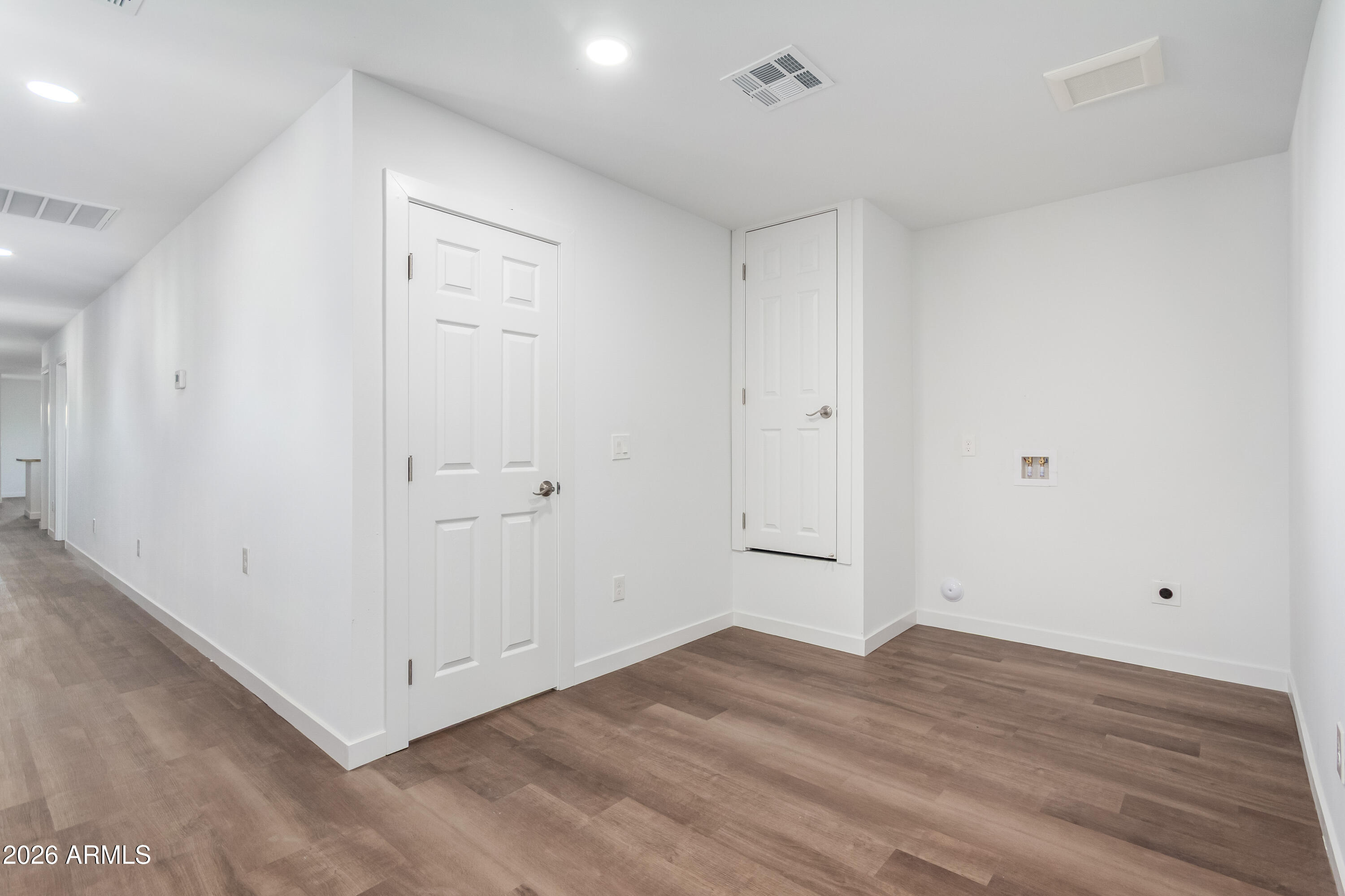 9155 West Adams Street Tolleson, AZ 85353 - Photo 13 of 29 a view of a room with wooden floor