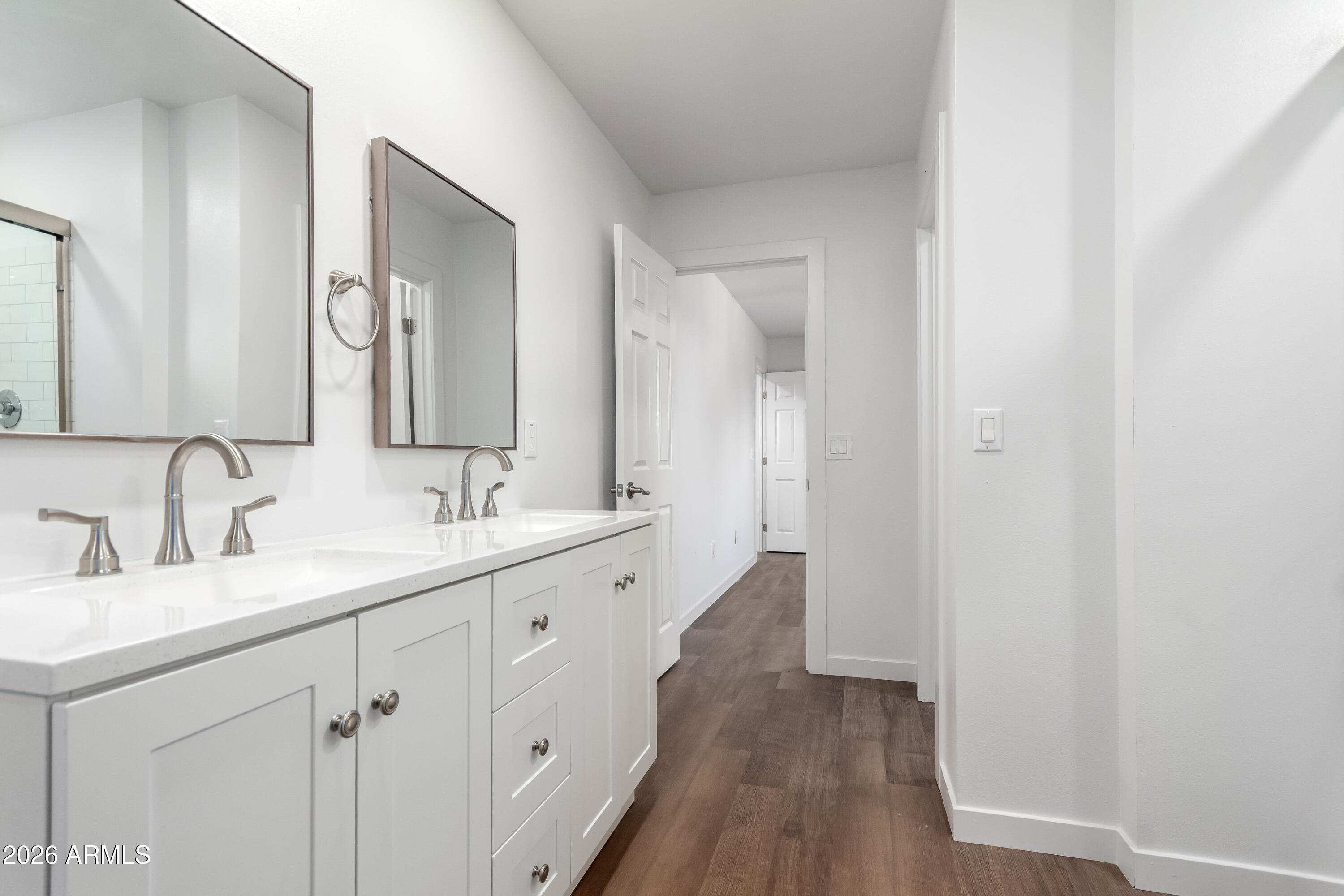 9155 West Adams Street Tolleson, AZ 85353 - Photo 18 of 29 a bathroom with 2 sink and a mirror
