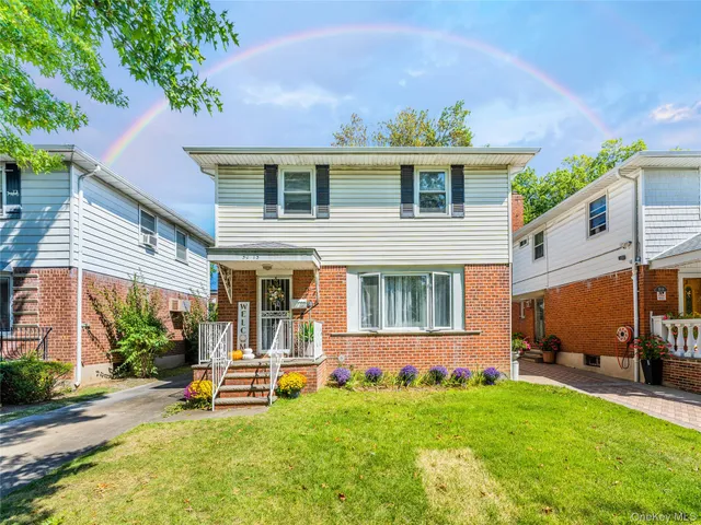 a view of a house with backyard porch and sitting area