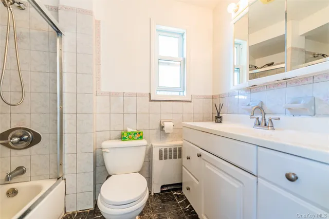 a bathroom with a sink a toilet and a bathtub