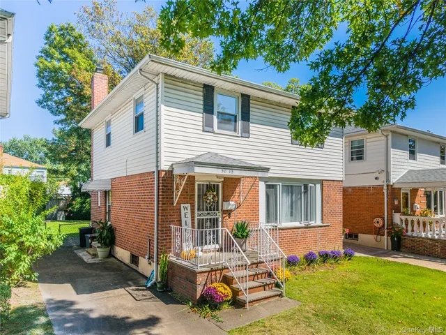a front view of house with yard outdoor seating and barbeque oven