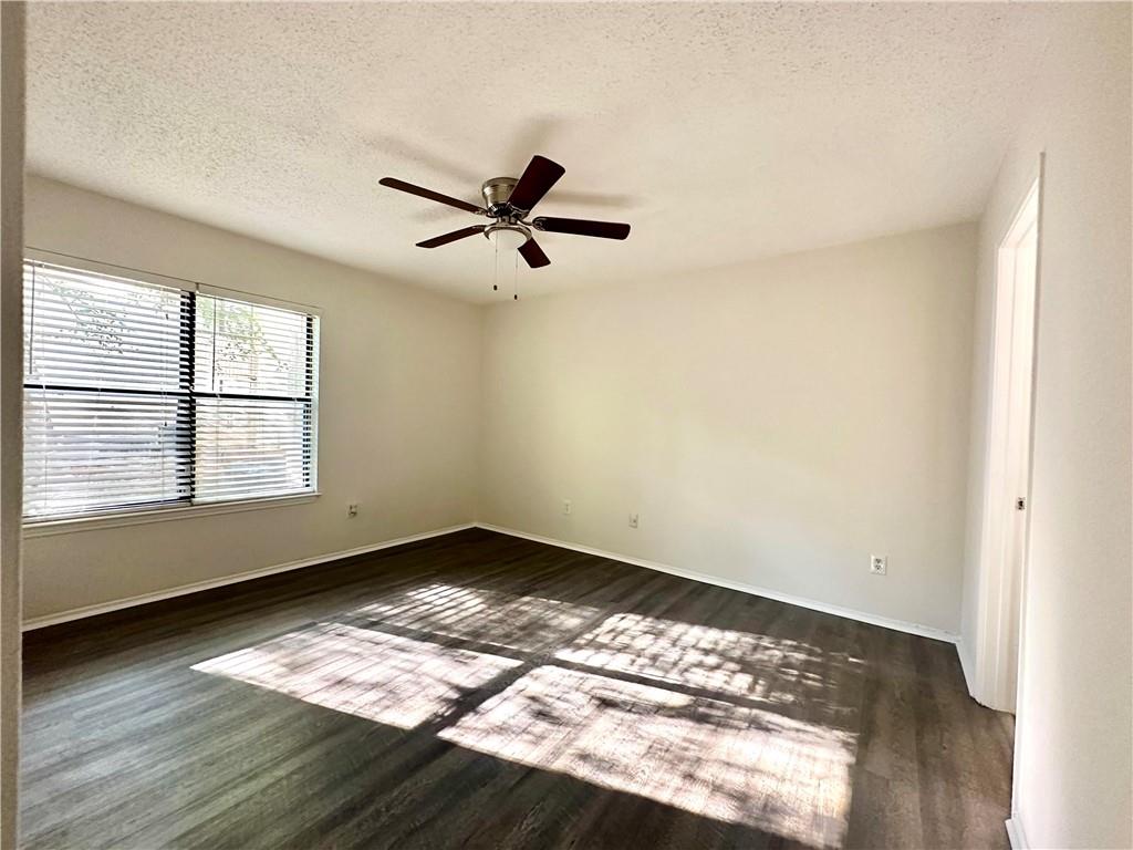 2301 Huntingdon Chase Atlanta, GA 30350 - Photo 11 of 15 a view of empty room with wooden floor and fan