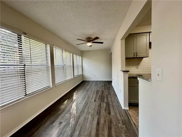 a view of a hallway with a window