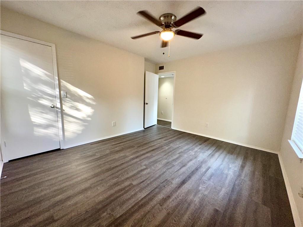 2301 Huntingdon Chase Atlanta, GA 30350 - Photo 10 of 15 an empty room with wooden floor and windows