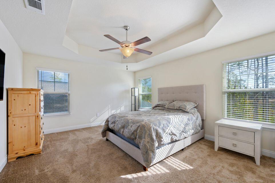 43 Brandywine Road Freeport, FL 32439 - Photo 6 of 23 a bedroom with a bed and a ceiling fan