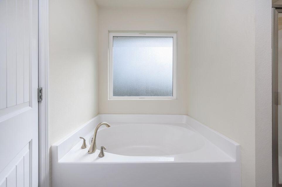 43 Brandywine Road Freeport, FL 32439 - Photo 8 of 23 a white bath tub sitting next to a window