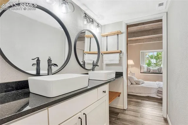 a view of a livingroom with furniture and staircase