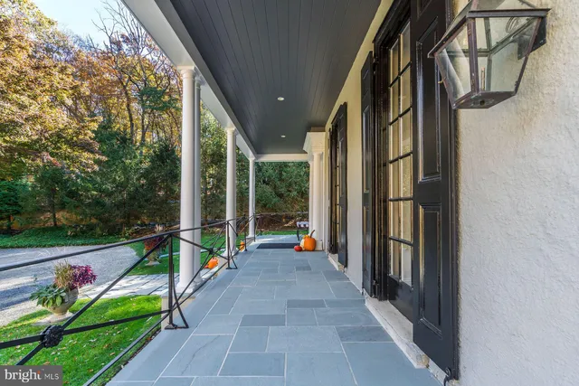 a dining room with furniture window and wooden floor