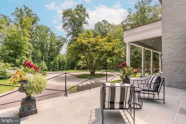 a dining room with furniture a fireplace and wooden floor