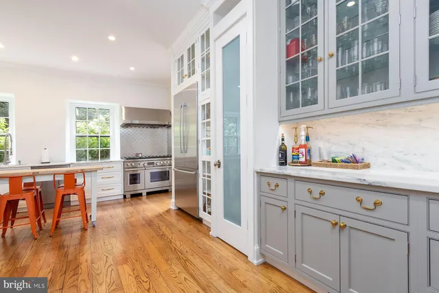 a view of a room with a large window and a table