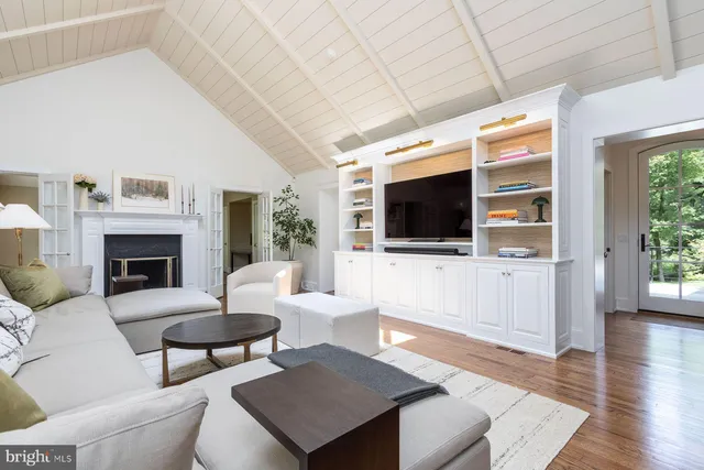 a bedroom with a bed and a fireplace