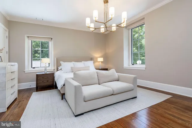a front view of a house with a yard fire pit and outdoor seating