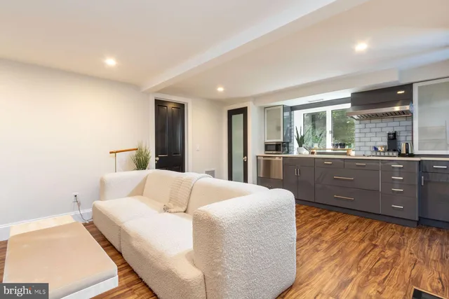 a view of a yard with table and chairs and potted plants