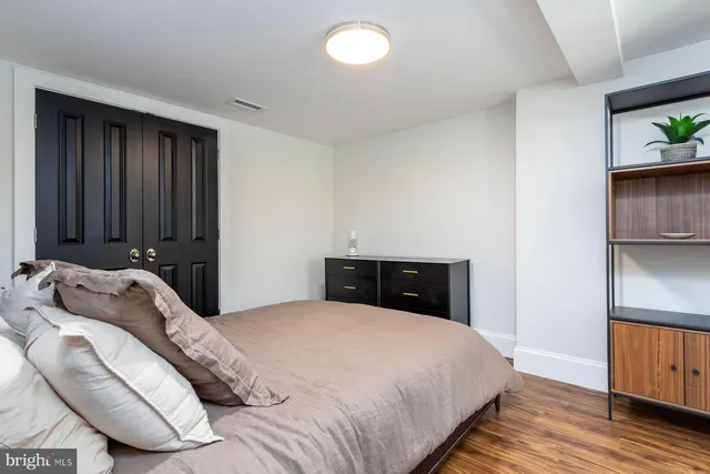 a view of a house with a yard and potted plants