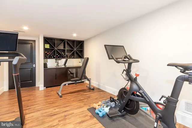 a view of a yard with plants and a bench