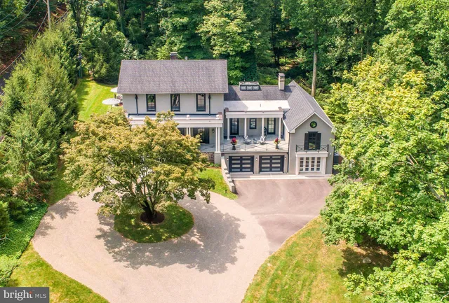 a front view of a house with a yard and porch