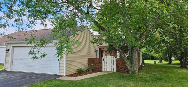 a view of backyard with a garden and entertaining space