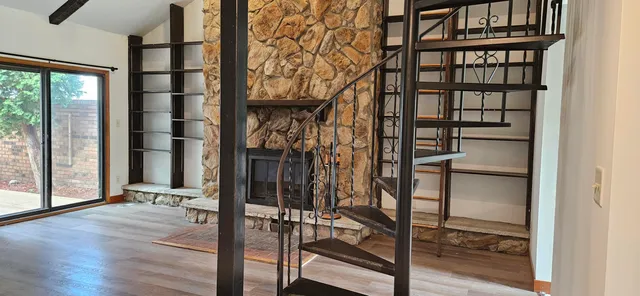 a view of an entryway with wooden floor