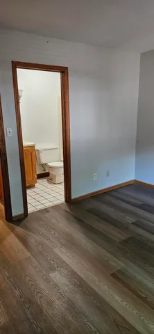 a view of an empty room and a window