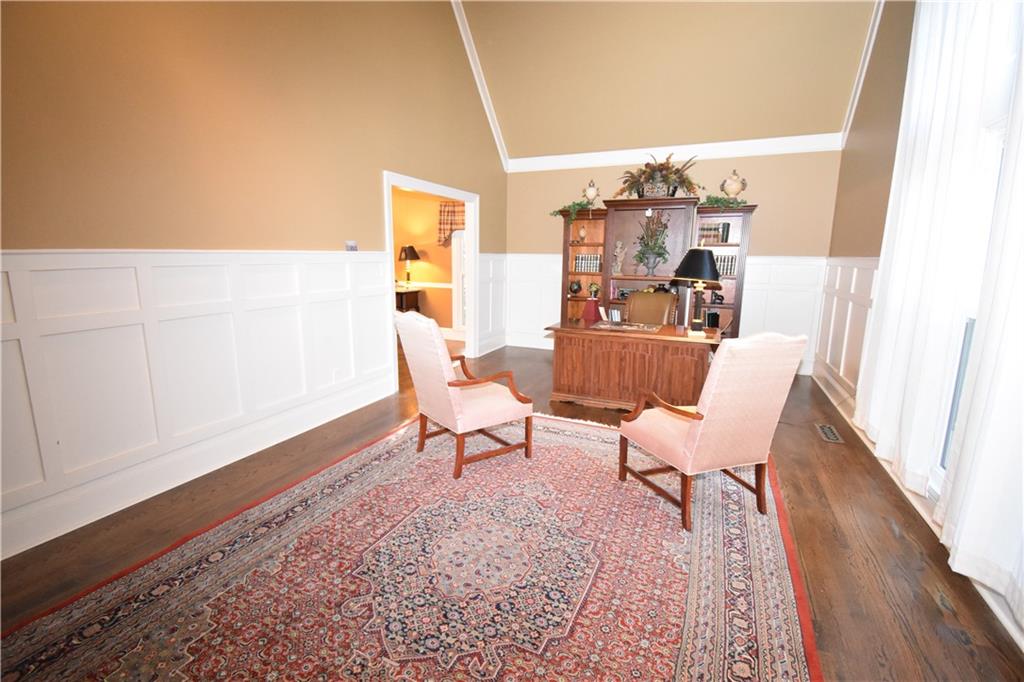 7700 Wickley Way Atlanta, GA 30350 - Photo 16 of 58 a living room with furniture and a wooden floor