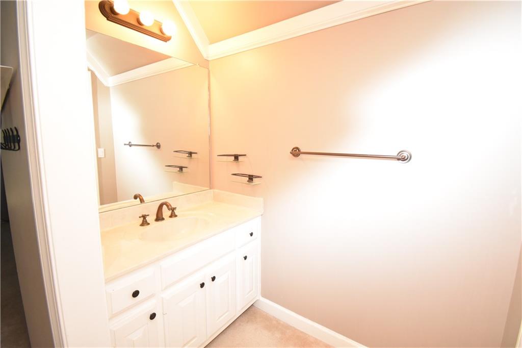 7700 Wickley Way Atlanta, GA 30350 - Photo 24 of 58 a bathroom with a tub and a shower