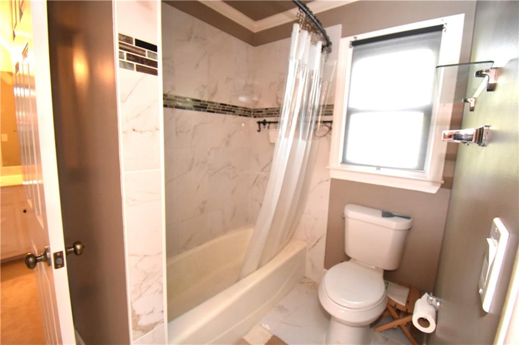 7700 Wickley Way Atlanta, GA 30350 - Photo 25 of 58 a white toilet sitting next to a bath tub shower