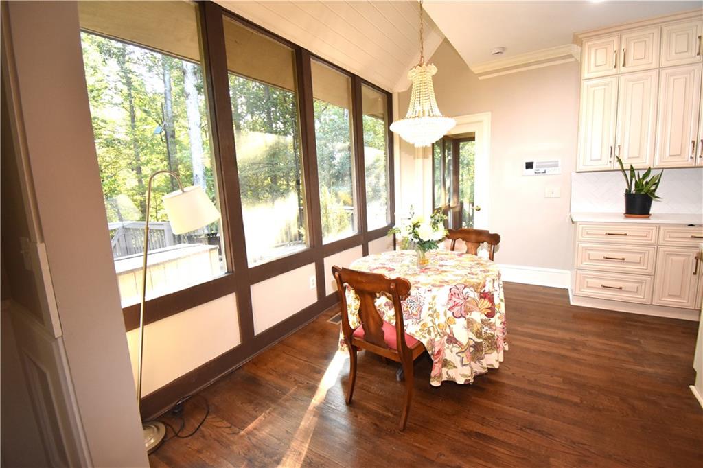 7700 Wickley Way Atlanta, GA 30350 - Photo 9 of 58 a dining room with furniture window and wooden floor