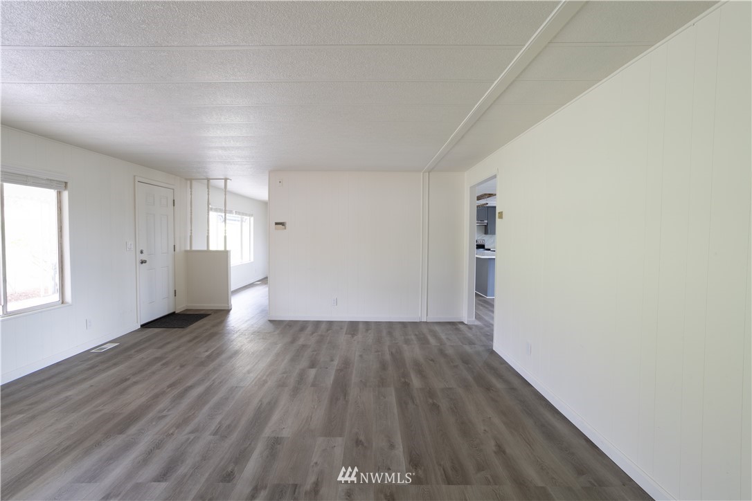 187 Senn Road Chehalis, WA 98532 - Photo 11 of 25 an empty room with wooden floor and windows