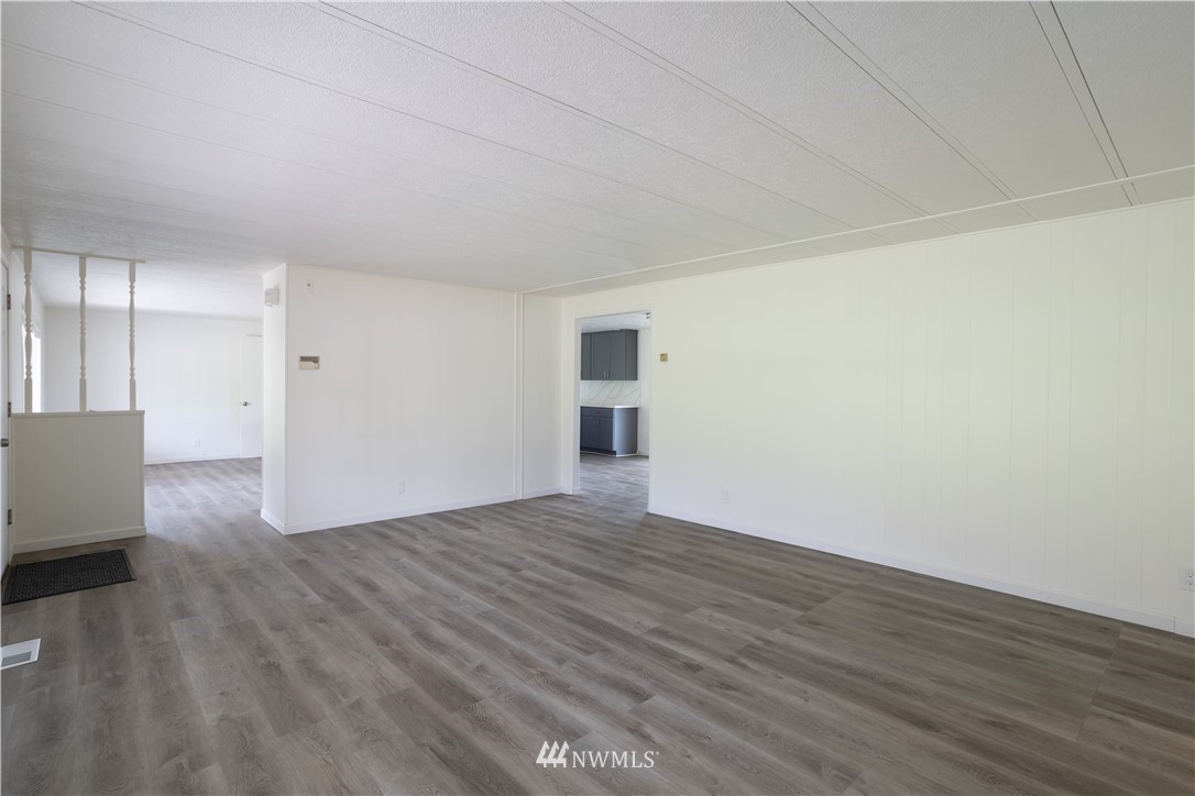 187 Senn Road Chehalis, WA 98532 - Photo 12 of 25 a view of an empty room with wooden floor and a window