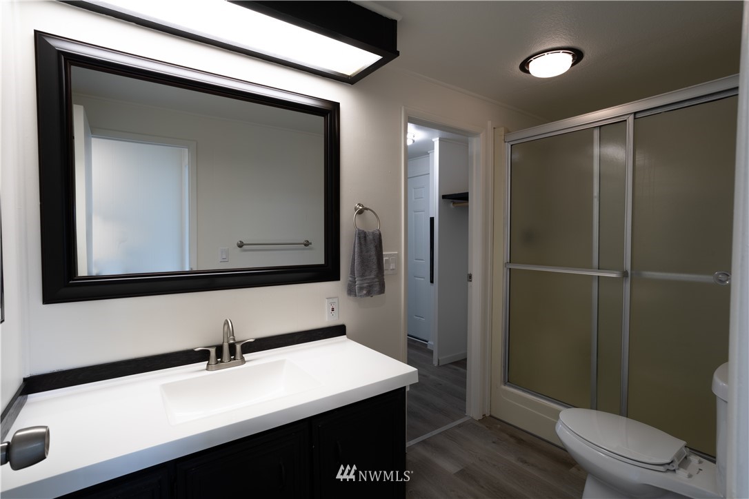 187 Senn Road Chehalis, WA 98532 - Photo 19 of 25 a bathroom with a sink a toilet and a mirror