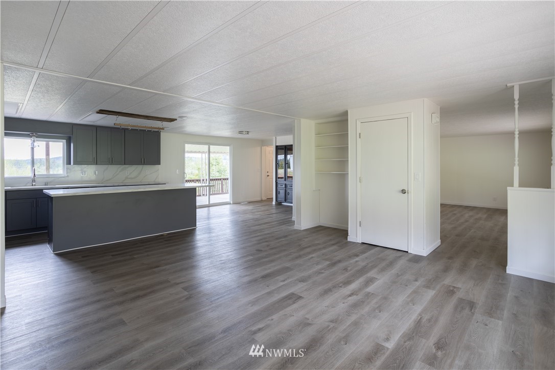 187 Senn Road Chehalis, WA 98532 - Photo 7 of 25 an empty room with wooden floor and windows