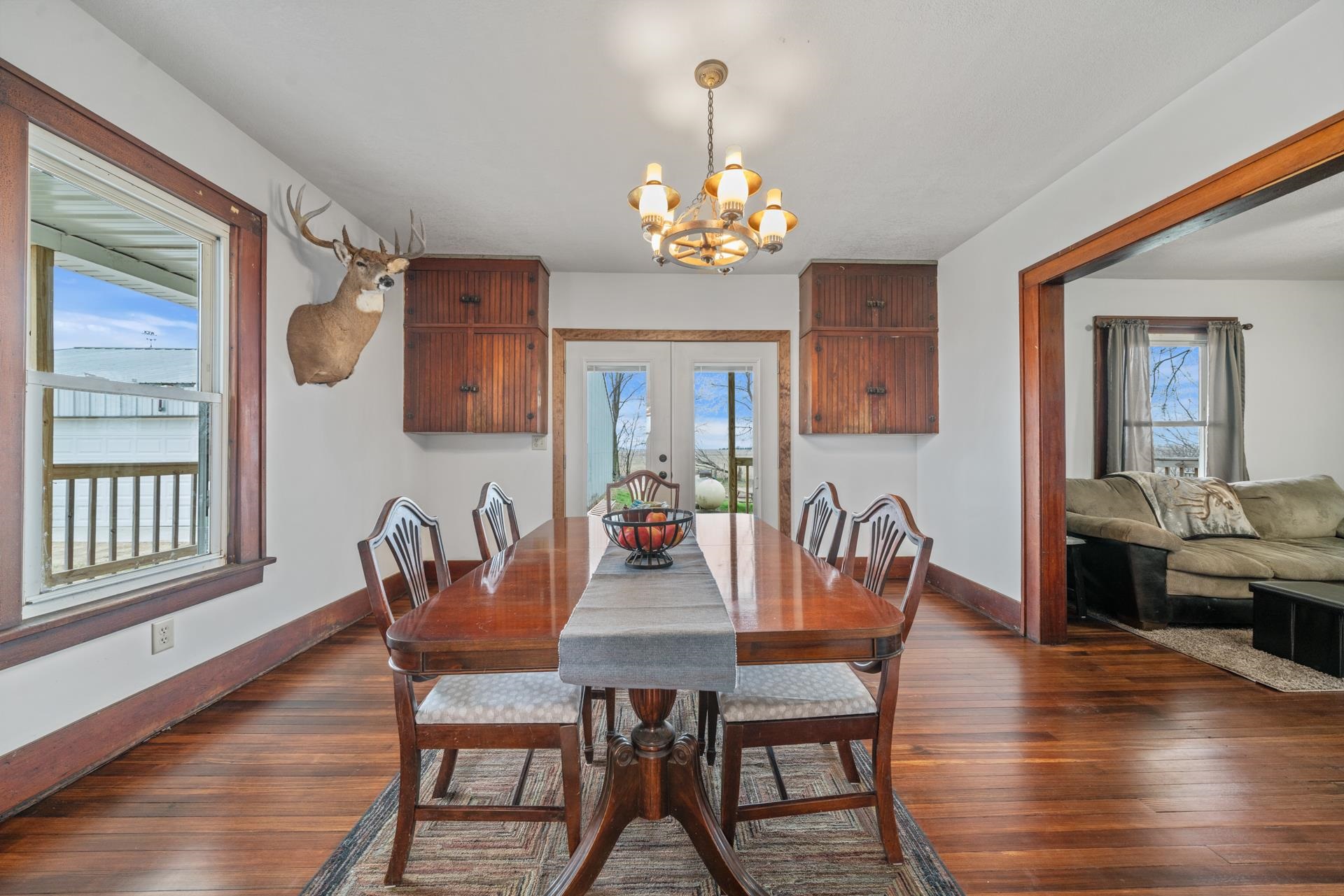 2068 Schnell Road Ashton, IL 61006 - Photo 3 of 39 a view of a dining room with furniture wooden floor and chandelier