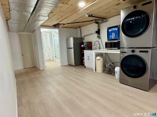 a view of a storage & utility room with washer and dryer