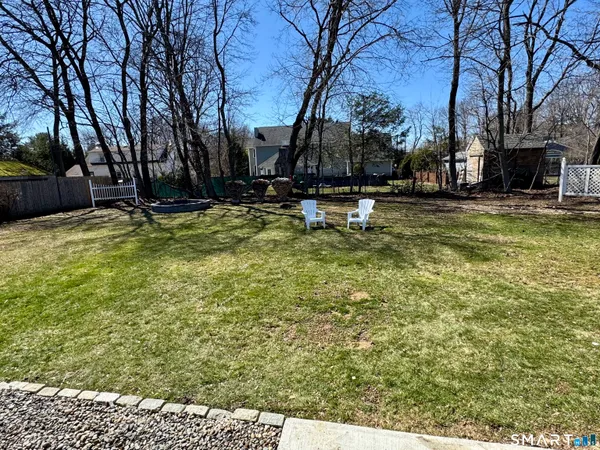 a view of swimming pool with outdoor seating and trees