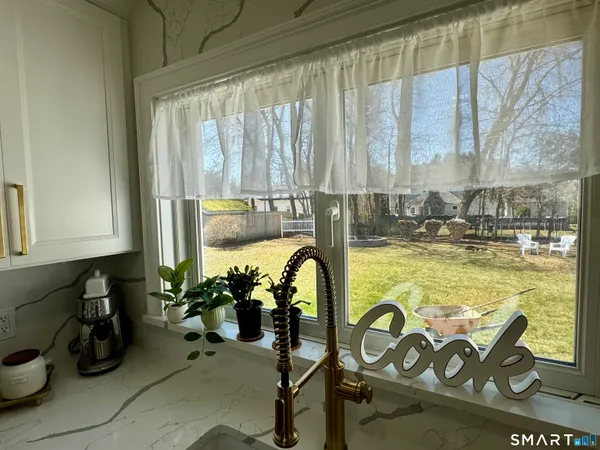 a view of a swimming pool with chairs