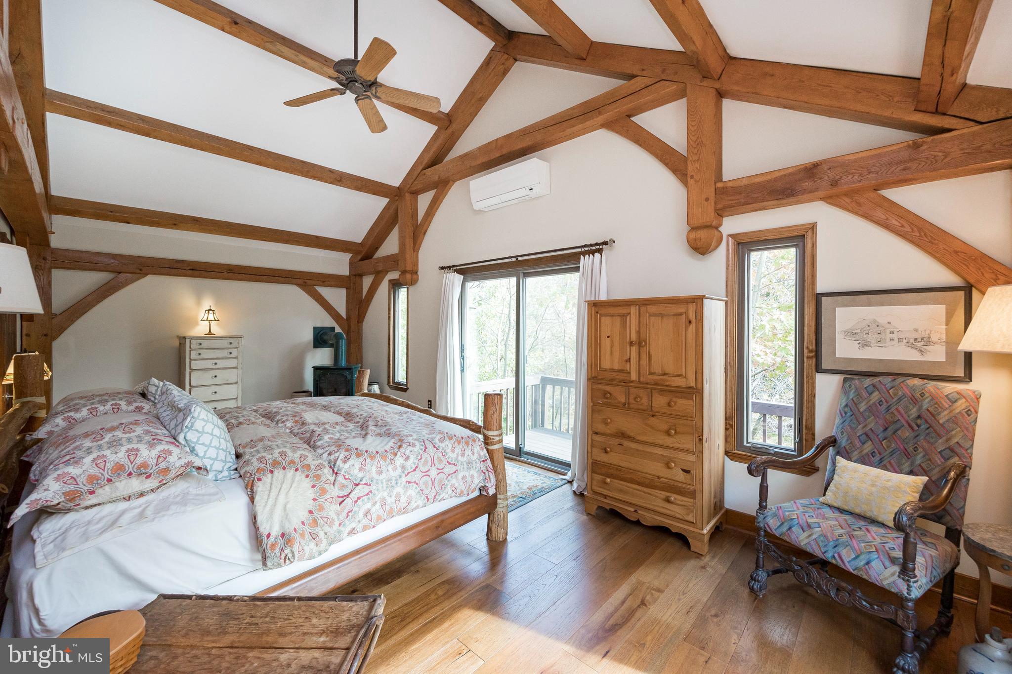 302 Landenberg Road Landenberg, PA 19350 - Photo 23 of 58 a bedroom with a bed and wooden floor