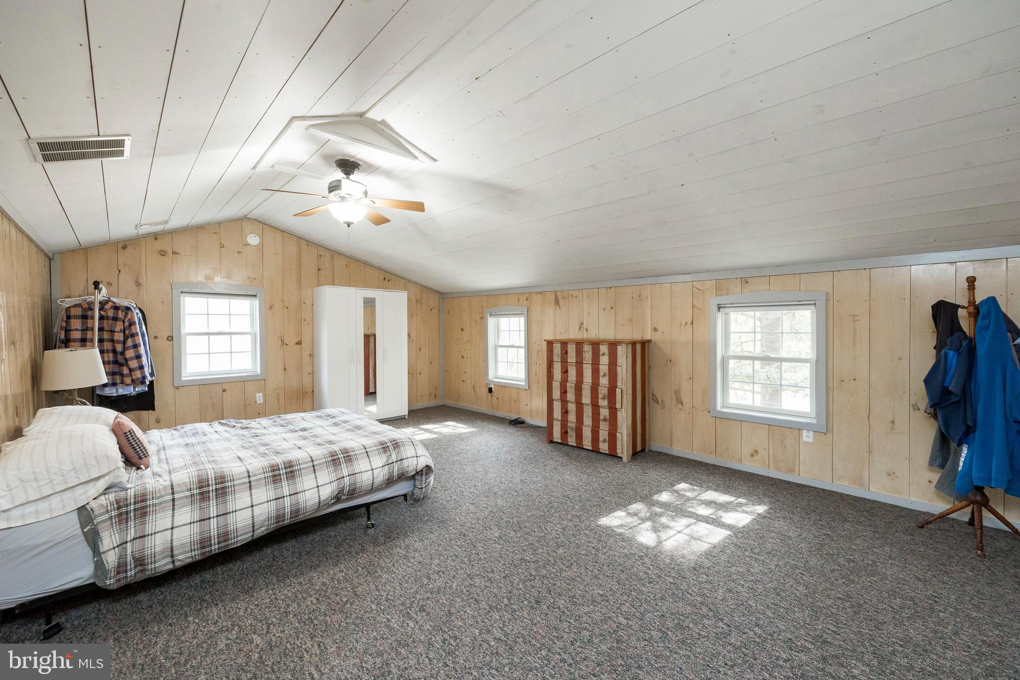 302 Landenberg Road Landenberg, PA 19350 - Photo 46 of 58 a spacious bedroom with a bed and a chandelier