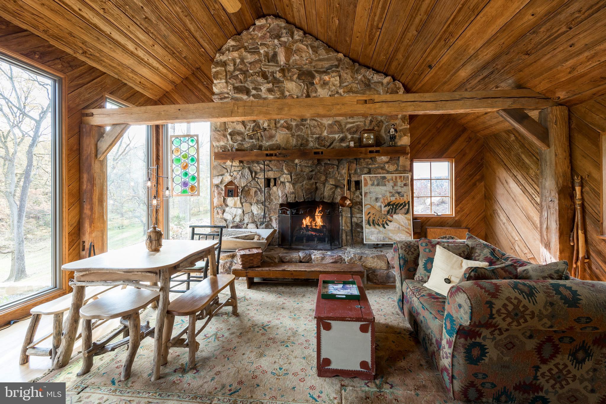 302 Landenberg Road Landenberg, PA 19350 - Photo 5 of 58 a living room with furniture a flat screen tv and a floor to ceiling window
