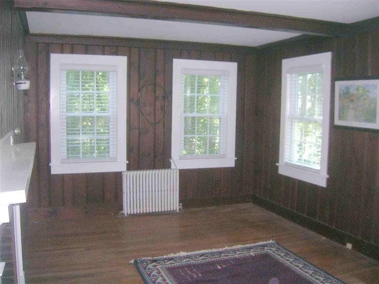 63 Old Mail Road North Chatham, MA 02650 - Photo 4 of 13 an empty room with wooden floor and windows