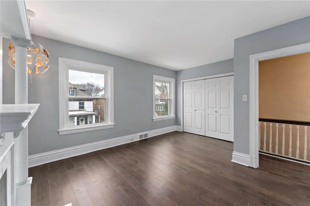 2002 Hampton Street Pittsburgh, PA 15218 - Photo 14 of 21 a view of an empty room with wooden floor and a window