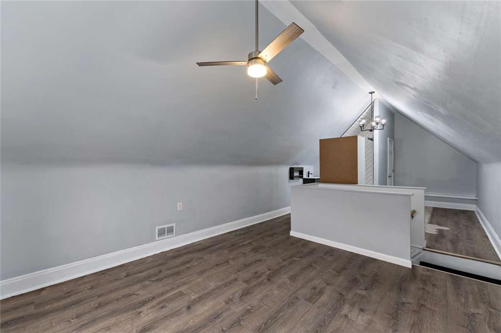 2002 Hampton Street Pittsburgh, PA 15218 - Photo 16 of 21 wooden floor in an empty room with a window