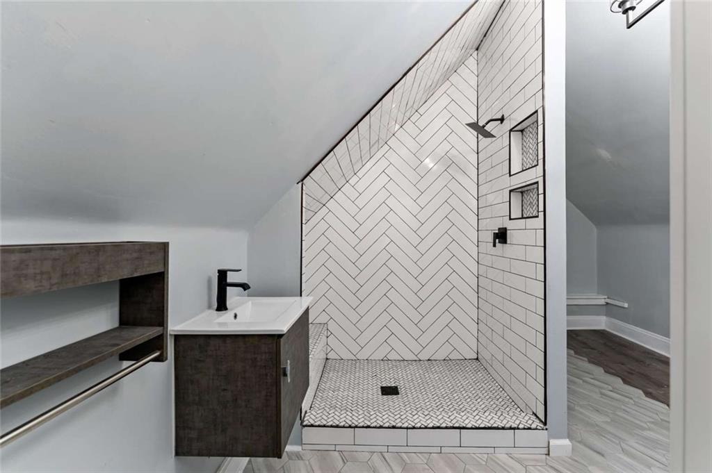 2002 Hampton Street Pittsburgh, PA 15218 - Photo 18 of 21 a bathroom with a sink and a shower