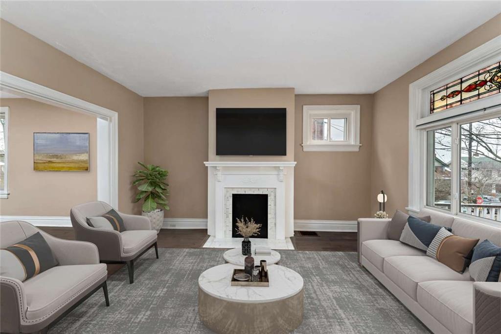2002 Hampton Street Pittsburgh, PA 15218 - Photo 3 of 21 a living room with furniture a fireplace and a flat screen tv